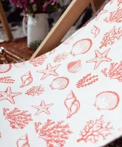 Magic Textiles Shells, Seaweed & Starfish Organic Linen Fabric - Coral On Off-White